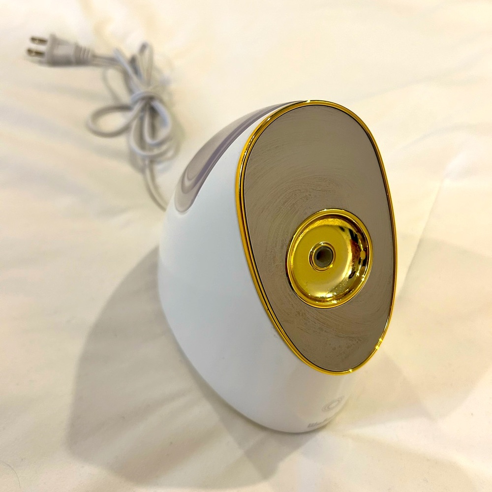 White and gold face steamer